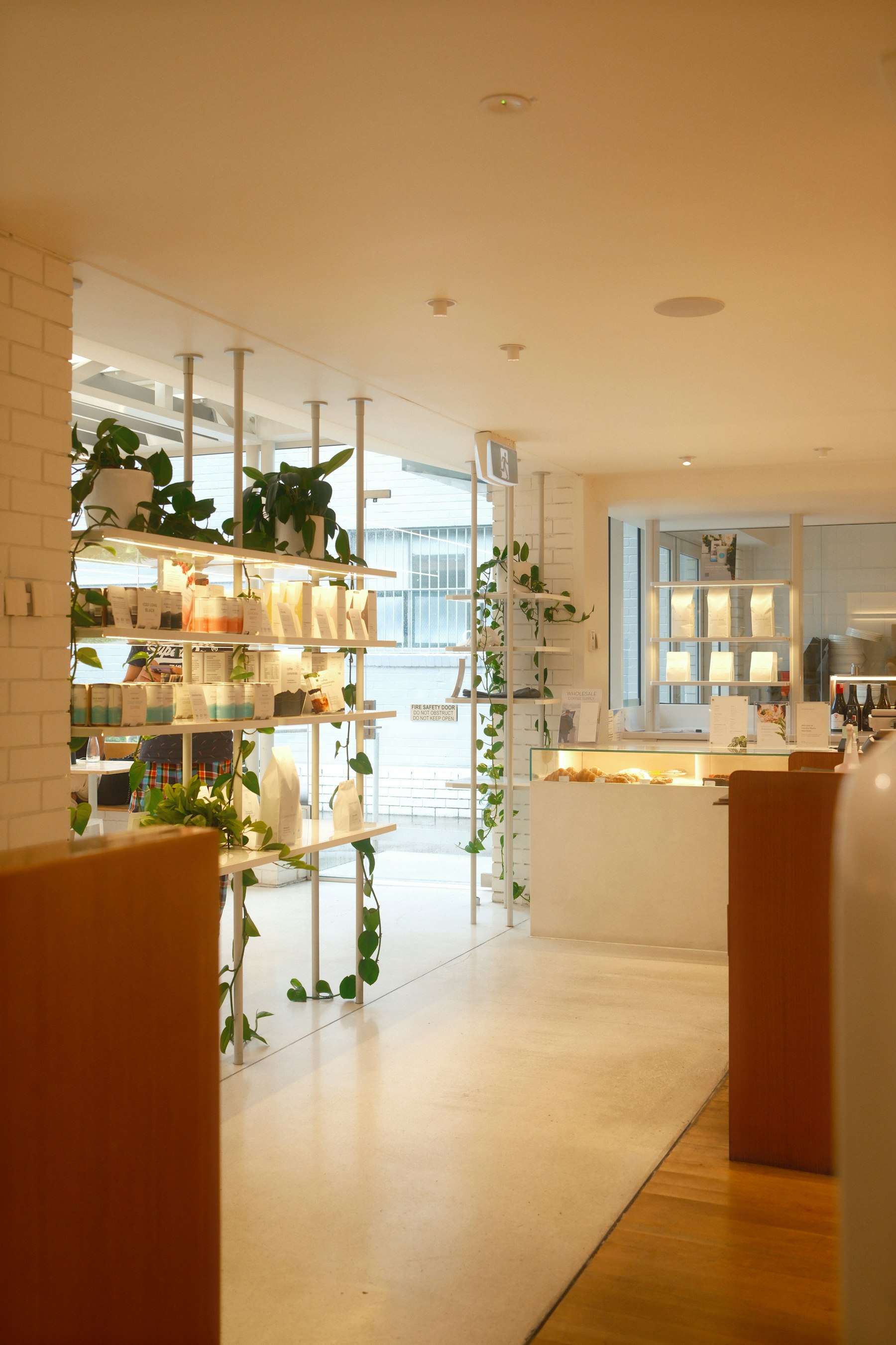 Bright finished retail interior with display shelving and counter, reference photo